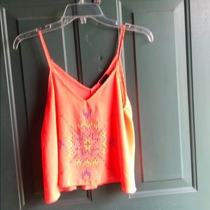 Orange crop top with bedazzled design